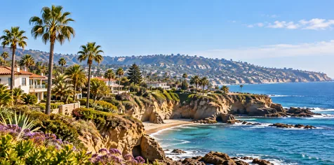 San Diego County coastline with cliffs, ocean, palm trees, and coastal homes