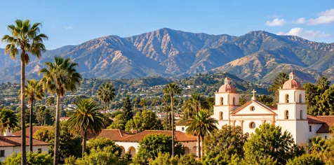 Santa Barbara County landscape with Spanish-style architecture, palm trees, and mountains